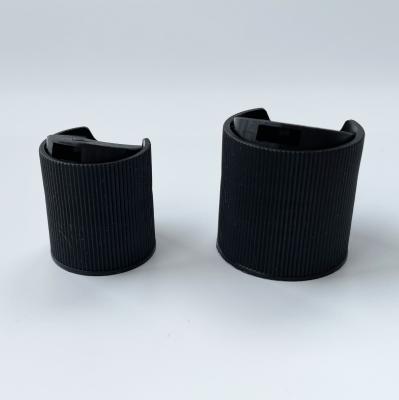 China Non Spill Black Polypropylene Ribbed Disc Top Wholesale For Plastic Bottles With 20mm 24mm 28mm Neck for sale