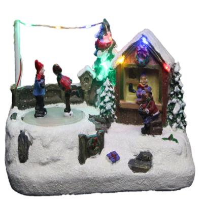 China Artificial Table Top Resin Christmas Shop With Movable Skaters Christmas Village Resin With Music for sale