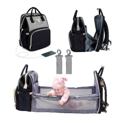 China Waterproof Foldable Baby Crib 3 in 1 Diaper Bag Backpack Travel Bag with USB Charging Baby Changing Bag for sale