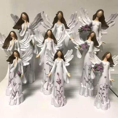 China Africa Wholesale Polyresin Decoration Statue Wing Angel Figures for sale