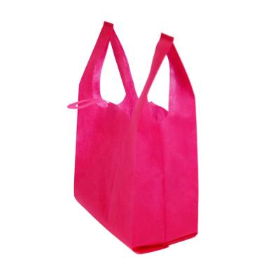 China Reusable Cheap Shopping Carry Vest Supermarket Non Woven T Shirt Bag In Stock With Various Colors And Sizes for sale