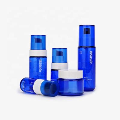 China Cosmetic Skin Care PET Bottles Plastic Lotion Pump Bottle Cream Jar Packaging Blue Skin Care Bottle Set for sale