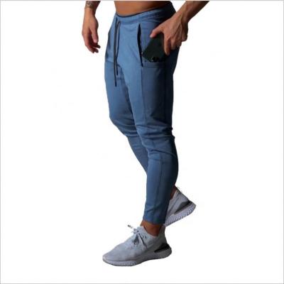 China 2021Men's Breathable Fashion Loose Fitted Pants Gyms Custom Fitted Sweatpants Casual Pants Joggers With Phone Pocket for sale