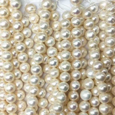 China Natural Freshwater Pearl Freshwater Cultured 10-11mm Pearl Strand Slightly Flawed White Close Round Pearl Loose for sale