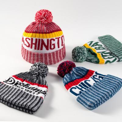 China COMMON Custom Logo Unisex Jacquard Pom Pom Beanie Wool Knit Hats Beanie Winter Hat for sale