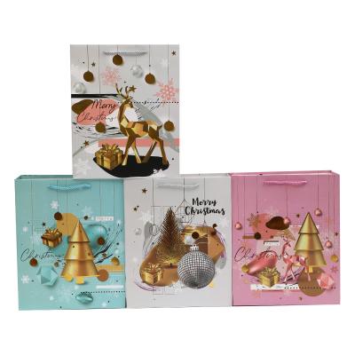 China Recyclable Christmas Paper Bag Christmas Tree Cardboard Gift Shopping Bag Printing Logo White Custom Paper Bag for sale