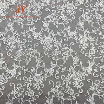 China Anti-static white color flower rope embroidery cord ivory lace fabric for bridal girls dress for sale