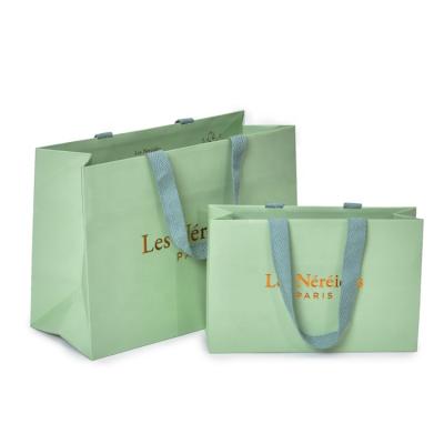 China Good Quality Factory Directly Beautiful Recyclable Kraft Paper Bags Customized Shopping Paper Bag For Clothes for sale