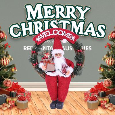 China Hanging Gift Wreath Sitting Santa Claus Figure Wreath Christmas Decoration Artwork Christmas Party Home Hanging Ornament for sale