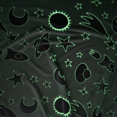 China Anti-pilling Amazon glow in the dark flannel sofa bed luminous stars blanket fabric for kids baby mantas luminosa for sale