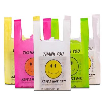 China China Factory Wholesale Heavy Duty Biodegradable Custom Food Grade T-shirt Bag Moisture Proof With Smile Face à venda