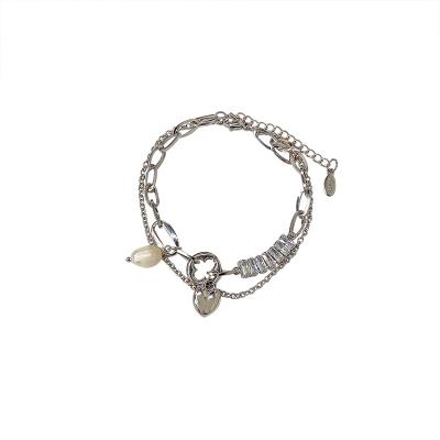 China Custom INS Cold Wind Accessories Zircon Patchwork Niche Bracelet Love Design Bead Female Upper Bracelet Unfading Custom Bracelet for sale