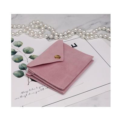 China Pink Single Button Jewelry Pouches Velvet Envelope Small Jewelry Packaging Pouch With Custom Printed Logo for sale