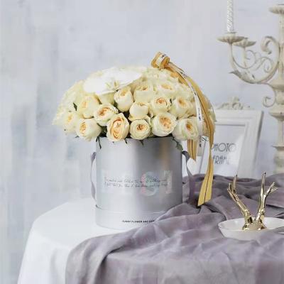 China Handmade Luxury Hot Sale Surprise Round Rose Flower Boxes Black Cardboard Paper Gift Boxes Packaging For Women for sale