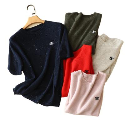 China Anti-wrinkle ladies short sleeve women's solid color pearl button basing slim sweater knitwear all-match knit bottoming shirt for sale