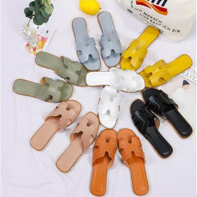 China Fashion Trend Ladies Shoes Designer Brand Slipper Pu Flat Casual Leather Women Beach Oran Sandals Strap Outdoor Casual Slipper One for sale