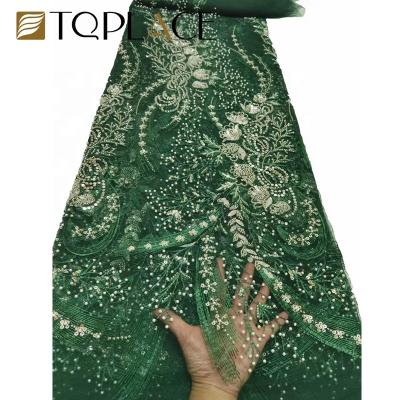 China Beautiful Sustainable French Green Heavy Tulle Embroidery Sequin Lace Up African Bridal Wedding Tulle Fabrics for sale