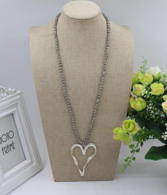 China Factory Stock FASHIONABLE Low Price Processing Silver Alloy Heart Shaped Pendant Necklace Exaggerated Long Crystal Spacer Sweater Chain for sale