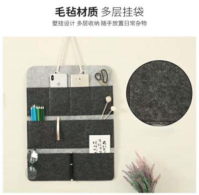 China Sustainable Storage Wall Bag Felt Hanging For Women Men Storage Sundries Solid Color Bag for sale