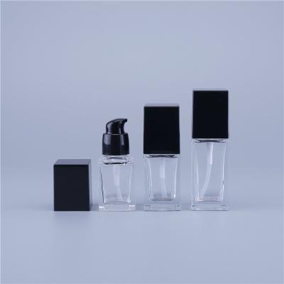 China Personal Care Square 15ml 20ml 30ml Empty Liquid Base Cosmetic Packaging Clear Glass Bottle With Pump In Stock for sale