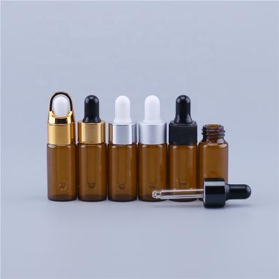 China Hot Selling Brown Essential Oil Personal Care Stock Cosmetic Sample Oil Package Amber Glass Dropper Bottle Empty With Dropper for sale