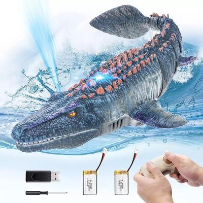 China Rc Animal With Water Mosasaur Model Toy 2.4ghz Rc Waterproof Electric Usb Battery Operated Diving Floating Spray Filling for sale