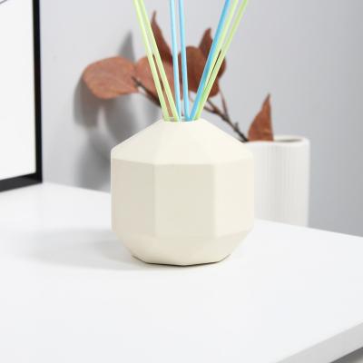 China Sustainable Novelty Coconut Shaped Colorful Modern Empty Perfume Diffuser Ceramic Tubular Jars for sale