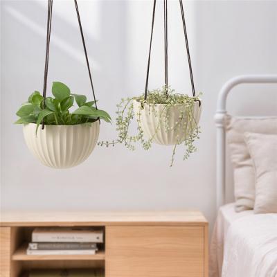 China Modern popular cheap indoor balcony porcelain hanging flower pot hung plant pots for home for sale