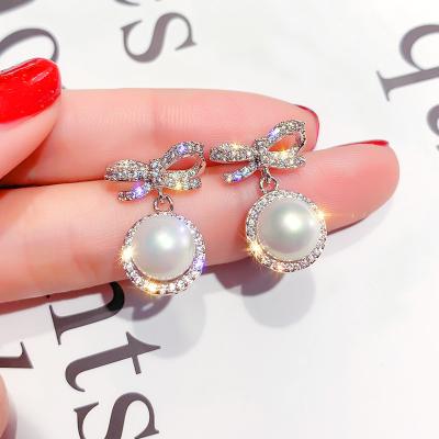 China Romantic 925 silver needle micro-set zircon bow earrings female Korean earrings temperament pearl earrings female for sale