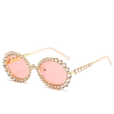 China 2020 new arrivals fashion sunglasses rhinestone oval sun glass women shape shades designer custmo logo luxury metal sunglasses women 0620 for sale