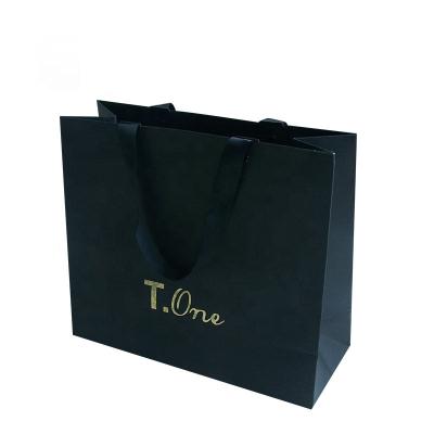 China Recyclable Custom Printed Colorful Kraft Gift Paper Packaging Bag With Handle for sale