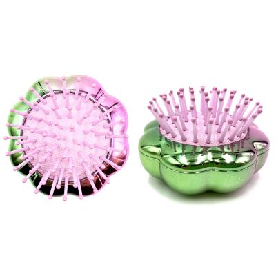 China 2022 Promotion Mini Portable Travel Electroplate Gradient Waterproof Flower Style Wholesale Telescopic Folding Hair Brush Comb for sale