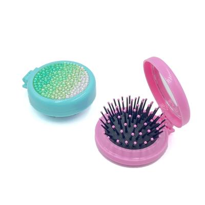 China Factory Custom Mini Travel Massage Detangling Glitter Compact Folding Hair Brush Waterproof Folding Hair Brush With Mirror for sale