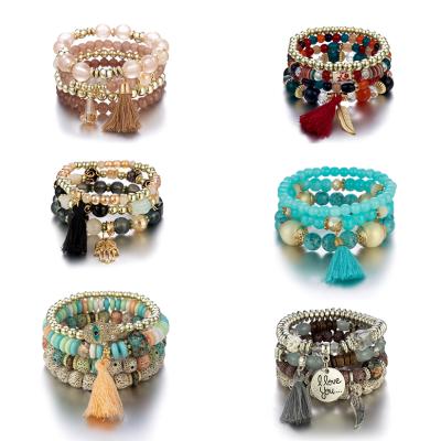 China BOHEMIA Wholesale Layered Couples Acrylic Beaded Bracelets Women With Charm Boho Tassel Glass Beads Bracelet Set Custom for sale