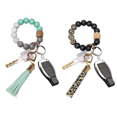 China Easy To Match Wholesale Clothing Silicone Beaded Bracelet Key Chain Round Bead WoodKeychain Rings Bracelet Multicolor Tassel Bracelet Key Chain For Women for sale