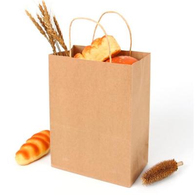 China Disposable Cheap Brown Kraft Paper Food Packaging Shopping Paper Bags With Handle for sale