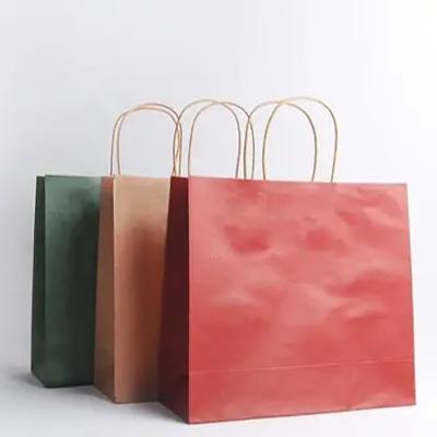 China Disposable Kraft Food Bag Craft Paper Shopping Gift Bags With Nylon Handle for sale