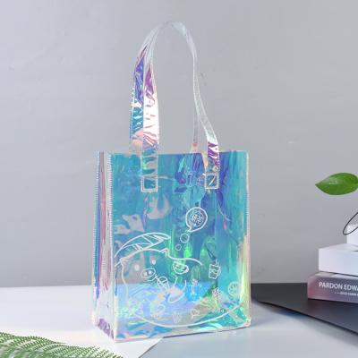 China Luxury Clear Handled Recycle Packaging Custom Shopping Bags Waterproof Plastic Colored Laser PVC Shopping Bag PVC Beach Bag for sale