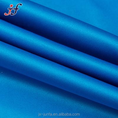 China Tear-resistant Polyester 145 Gsm Microfiber Peach Skin Satin 100% Plain Apparel Fabric for sale