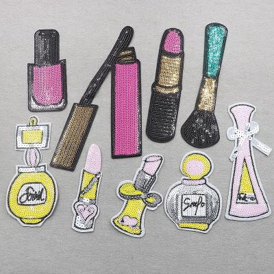 China Clothes Computer Embroidery Sequin Patches Lipstick Perfume Bottle And Foundation Brush for sale