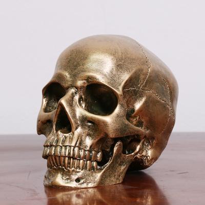 China Europe gold resin skull ornaments creative home accessories resin skull decoration 21315 for sale