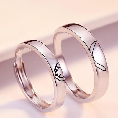 China Environmentally Friendly Custom Adjustable Valentine's Day Present Couple Rings Holding Hands Style Ring Jewelry for sale