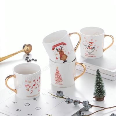 China HY Christmas Porcelain Cup Christmas Snowman Mug Viable Ceramic Cup Gold Handle Ceramic Cup Custom Mug for sale