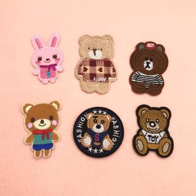 China Sustainable Custom Fabric Embroidered Badges Sew On Embroidery Patches Apparel for sale