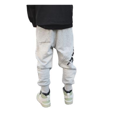 China Color Fade Proof Cotton Baby Boy Walkers Pants Simple Empty Black Printed Kids Girl Walkers Sports Tracksuit For Kid for sale