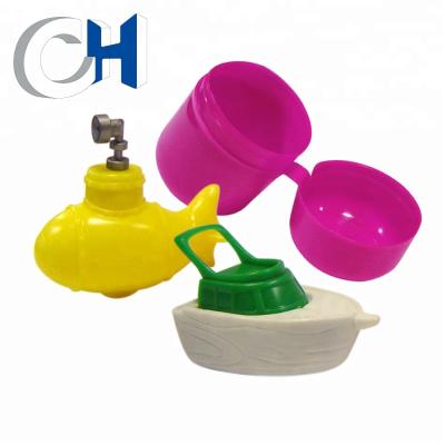 China Professional Creative Freewheel 4cm Colored Plastic Toy Ship Bottle Cap for sale