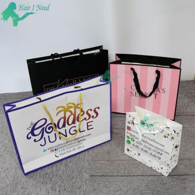 China Recyclable Fashion Custom Logo Shopping Bag Gift Paper Bag With Ribbon Handle for sale