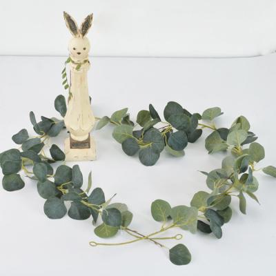 China Various Styles Wholesale Green Faux Eucalyptus Leaves Vines Artificial Wreath For Wedding Decoration for sale