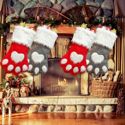 China Lovely Colorful Custom Plush Pet Paw Christmas Stocking Decorations Candy Bag Bulk Xmas Window Hanging Ornament for sale