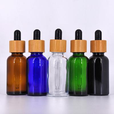 China 30ml/1oz Botellas Cosmetic Glass Dropper With Bamboo Lids Travel Perfume Container Glass Cosmetic Liquid Bottle For Essential Oil for sale